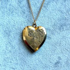 vintage 10k gold filled locket from the 1950s with hand engraved detail on 16" handmade 14k gold filled chain  chain can be extended upon request via messages Antique Gold Locket Necklace Stamped 14k, Collectible Yellow Gold Necklace With Heart Charm, Heirloom Heart-shaped Jewelry With Vintage Charm, Vintage Charm Heart-shaped Yellow Gold Jewelry, Victorian Brass Necklace With Heart Charm, Yellow Gold Heart Jewelry With Vintage Charm, Collectible Heirloom Necklace For Valentine's Day, Valentine's Day Medallion Necklace With Vintage Charm, Valentine's Day Vintage Charm Medallion Necklace