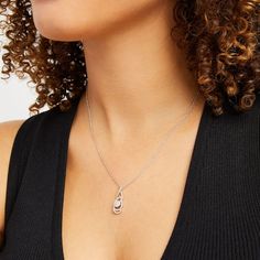 Find an elegant new look with this mesmerizing multi-diamond flame looped infinity pendant. Created in sterling silver A diamond-lined ribbon loops and twists into flame, infinity symbol and teardrop shapes. At the center, a larger diamond is artfully set to enhance to enhance size and sparkle and wrapped in a diamond halo. Captivating with 1/3 ct. t.w. of diamonds This pendant suspends along an 18.0-inch rope chain that secures with a spring-ring clasp. White Jewelry With Diamond Accents And Modern Twist, Silver Jewelry With Brilliant Cut In A Modern Twist, Modern Twist White Gold Cubic Zirconia Jewelry, Modern Twist Silver Jewelry With Brilliant Cut, Modern Twist White Gold Jewelry With Diamond Accents, Modern White Gold Cubic Zirconia Jewelry, Modern White Gold Jewelry With Diamond Accents, Infinity Pendant, Infinity Symbol