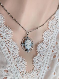 Step back in time with this beautifully crafted vintage-inspired oval cameo necklace. Featuring an intricately detailed cameo set in an antiqued silver pendant with delicate leaf accents, this necklace exudes timeless elegance and charm. Whether you're a vintage enthusiast, a lover of historical romance, or simply appreciate classic style, this piece is perfect for adding a touch of old-world grace to any outfit. Whether you're dressing up for a special event or simply adding a bit of historical flair to your everyday style, this cameo necklace is a versatile and elegant choice.  Add this timeless piece to your collection or gift it to someone special who appreciates the elegance of a bygone era! The Victorian cameo pendant is made of silver-plated brass. It is 1 3/16 inches (30mm) long, a Victorian Cameo, Small Business Gifts, Victorian Necklace, Cameo Earrings, Vintage Lovers, Vintage Inspired Jewelry, Cameo Necklace, Bygone Era, Cameo Pendant