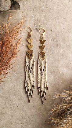 Thalia  ♀ Handmade  beaded native earrings  ♀ Glass Beads: Toho, Czech  ♀ Ear Wire: 18k gold-plated brass  ♀ Drop Height: 7 in. ♀ Nickel Free Visit www.moonandmilk.com and get 20% off!  use code: ETSY20 LINK FOR EARRINGS:  https://moonandmilk.com/products/thalia-cream-boho-beaded-earrings White Heishi Beads Artisan Jewelry, Bohemian Long Drop Jewelry With Tiny Beads, White Artisan Heishi Bead Jewelry, White Beaded Fringe Jewelry For Crafting, Bohemian Heishi Beads Dangle Jewelry, Bohemian Dangle Jewelry With Heishi Beads, Unique Beaded Natural Jewelry, Natural Beaded Dangle Jewelry, Natural Color Beaded Dangle Jewelry