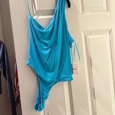 Such A Pretty Blue Chic Blue Bodysuit For Spring, Chic Blue Bodysuit For Summer, Chic Blue Summer Bodysuit, Casual Blue Bodysuit For Night Out, Blue Sleeveless Bodysuit For Spring, Blue Summer Bodysuit For Parties, Blue Bodysuit For Summer Parties, Chic Blue One-piece Bodysuit, Casual Blue Bodysuit For Loungewear