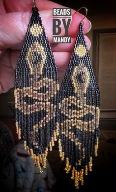 Hand beaded earrings. Colors: black and golds Length: 4 1/2 in Width: 1 in Kiwi Earrings, Hand Beaded Earrings, Bead Earring, Beading Inspiration, Handmade Earrings Beaded, Earring Ideas, Snake Earrings, Snake Necklace, Earrings Beaded