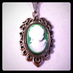 This Is A Gorgeous Handmade Superbly Detailed Cameo! From Her Hair, To The Roses On Her Dress, To Her Dainty Detailed Pearl Necklace! This Beautiful Green Cameo Is 1 1/8h X 3/4"W And Is Suspended From An 18" 925 Sterling Silver Chain With A Lobster Claw Clasp. Excellent Gift For Yourself Or Your Loved Ones! Comes Already Gift Wrapped And In A Fancy Gold Gift Box! Comes From A Smoke And Pet Free Environment. Please Ask Any Questions You Have. Offers Welcome! Bundle Items From My Closet And Save! Classic Cameo Necklace For Gift, Classic Cameo Necklace As Gift, Silver Cameo Round Pendant Jewelry, Silver Cameo Jewelry With Round Pendant, Nickel-free Oval Pendant Necklace For Formal Occasions, Round Silver Cameo Necklace, Formal Nickel-free Necklace With Oval Pendant, Formal Nickel-free Oval Pendant Necklace, Silver Cameo Jewelry For Anniversary