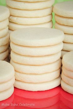 a pile of white cookies sitting on top of each other