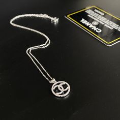 SHOP MORE LUXURY PRODUCTS HERE Description Chanel Necklace Chanel signSilver color hardware This product is the premium quality. This product will come with box. Chanel Sign, Necklace Chanel, Louis Vuitton Shirt, Chanel Shirt, Chanel Necklace, Dior Jewelry, Jewel Necklace, Gucci Gg Marmont, Luxury Products