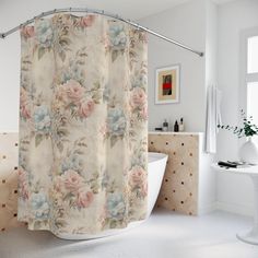 a bathroom with a bathtub, sink and shower curtain that has flowers on it