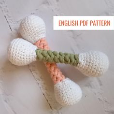 two crocheted carrots are tied together on a white surface with the words english ppf pattern below it