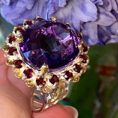 One Of A Kind Ring With Genuine 32 Ct Amethyst, Encrusted With Genuine Rhodolite, Quintessential British Style, Similar To The One That Adorned The Hand Of British Monarchy Family Member. 925 Sterling Silver, White Gold Overlay, 14k Yellow Gold Accents. Just Majestic, High Quality Ring! Brand New, Pristine Condition Luxury Amethyst Gemstones With Accent Stones, Exquisite Amethyst Ring With Gemstone Accents For Formal Occasions, Formal Multi-stone Amethyst Ring With Round Cut, Formal Amethyst Gemstones With Gemstone Accents, Formal Amethyst Gemstones With Accents, Luxury Amethyst Ring With Gemstone Accents As Gift, Luxury Round Amethyst Ring With Gemstone Accents, Luxury Amethyst Gemstones For Anniversary, Fine Jewelry Ruby Gemstones With Accents