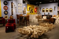 a room filled with lots of different types of furniture and decor items on display next to each other