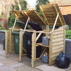 an outdoor storage shed with the roof open