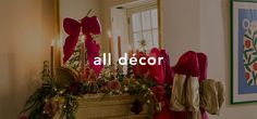 a decorated mantle with candles and christmas decorations in front of a mirror that says all decor