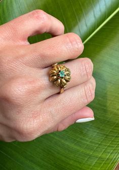 18k Vintage Natural Emerald Large Flower Ring          Description:     18k Vintage Natural Emerald Large Flower Ring Size: 7.25 ( Can be resized) flower measures 13.3mm in length Natural Emerald measures: 3.9mm          Details:               Material: Please refer to product specifics for details          Design: Unique and elegant          Style: Versatile, perfect for any occasion          Perfect for: Everyday wear, special occasions, gifts               Why You'll Love It:               Timeless Design: Adds a touch of elegance and sophistication to your look.          High-Quality Craftsmanship: Ensures durability and timeless appeal.          Versatile Style: Perfect for both everyday wear and special occasions, making it a versatile addition to your jewelry collection.          Su Unique Floral Design, Vintage Ring, Natural Emerald, Flower Ring, Large Flowers, Versatile Style, Flower Design, Elegant Style, Vintage Rings