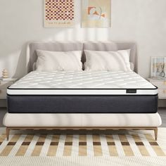 an image of a mattress in the middle of a bed frame with pillows on it