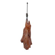 a piece of wood hanging from a hook