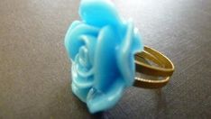 A lovely vintage style adjustable flower ring with a brass base on which sits a beautiful sky blue rose flower. The flower measures about 20mm.I will ship this out lovingly wrapped in tissue and a beautiful organza bag for easy gift giving.For more adjustable rings, please go to http://www.etsy.com/shop/Dewdropsdreams?section_id=10878805For more vintage style, bridal and fun jewelry, please visit my shop at www.dewdropsdreams.etsy.com.Thank you for visiting my shop. Elegant Blue Adjustable Flower Ring, Elegant Adjustable Blue Flower Ring, Adjustable Blue Flower Ring, Adjustable Blue Flower Ring For Gifting, Adjustable Blue Flower Ring Gift, Blue Rose Flower, Light Blue Roses, Buy Jewellery Online, Blue Ring