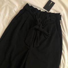 Size Xs Brand New With Tag Serious Inquiries Only ! Spring Paperbag Waist Bottoms For Night Out, Spring Night Out Bottoms With Paperbag Waist, Spring Night Out Paperbag Waist Bottoms, Chic Black Pants With Tie Waist, Chic Black Tie Waist Pants, Paperbag Waist Pants For Night Out In Spring, Spring Paperbag Waist Pants For Night Out, Black Wide Leg Pants With Tie Waist, High Waist Black Pants For Day Out