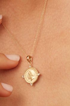 Our Legacy Coin Pendant Charm is the perfect brdige of history and style. Celebrating legacy and heirlooms, it depicts King George V, celebrated for his leadership during a pivotal era. The coin's vintage allure is enhanced by modern design elements, making it a versatile addition to any jewelry collection. Metal: 14k Solid Gold Dimensions: 20mm Coin Diamenter, 4mm Bale Opening Weight: 1.7 grams Origin: Crafted in Arezzo, Italy Heirloom Diamond Jewelry Tarnish Resistant, Classic Gold Jewelry With Coin Pendant, Elegant Gold-plated Coin Jewelry, Elegant Coin Pendant Necklaces For Commemoration, Vintage Yellow Gold Necklace With Diamond Accents, Classic Coin Jewelry For Commemoration, Classic Medallion Jewelry With Diamond Accents, Elegant Gold Coin Jewelry, Elegant Commemoration Coin Pendant Jewelry