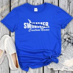 a t - shirt that says swimmer custom name next to some shoes and a pair of jeans