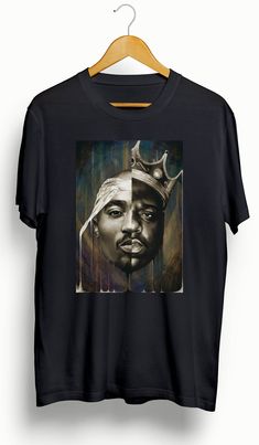 This is a custom 2Pac | Biggie Custom T-Shirt. Please view photos for size chart. Message us for custom colors or styles. Features • 5.3 oz., 100% preshrunk cotton • Double-needle sleeve and bottom hems •Taped neck and shoulders•Classic midweight fabric•Classic fit tubular body •7/8" collar•Classic fit•Tear-away labelCare:Machine wash cold inside out. Hang dry or low dry. Never iron directly on graphic. Streetwear Relaxed Fit T-shirt With Custom Artwork, Relaxed Fit T-shirt With Custom Artwork For Streetwear, Cotton Tops With Custom Artwork For Streetwear, Black Custom Print Fan T-shirt, Black Custom Print Fan Apparel T-shirt, Fan Merchandise T-shirt With Custom Artwork And Crew Neck, Black Custom Print T-shirt, Fan Apparel, Black T-shirt With Custom Print For Fans, Urban T-shirt With Custom Print For Streetwear