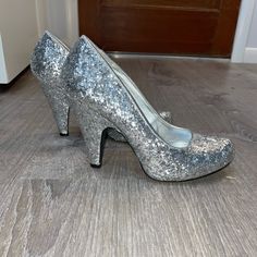 Qupid Silver Glitter Heels. Worn Once. Size 7. Almost Brand New. No Scuffs On Outside Glitter Heels With Round Toe In Synthetic, Glamorous Glitter Heels In Synthetic, Sequined High Heels In Synthetic Material, Holiday Sequined Heels With Round Toe, Holiday Sequined Round Toe Heels, Holiday Heels With Glitter Accents And Round Toe, Shimmer Round Toe Heels For Party Season, Holiday Glitter Heels With Round Toe, Shimmer Round Toe Heels For Prom