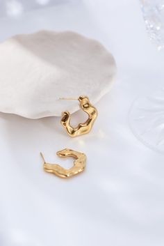 Beautifully winding along, like lava in motion. Meet our Gold Lava Hoops. These earrings are real 18k gold plated, and feature a unique design inspired by vintage jewellery of the past.  Light-to-medium weight, so perfect for all-day wearing.  Waterproof, sweat-proof and life proof! All our earrings are made of the highest quality materials and are free from nickel and brass, so won't ever tarnish, rust or turn your skin green!  Features 18k gold plated sterling silver and butterfly backs. LIGHT Sweat Proof, Polish Jewelry, Vintage Jewellery, Independent Designers Fashion, Gold Plated Sterling Silver, Badger, Medium Weight, Designer Fashion, Gold Jewelry