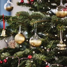 a christmas tree with ornaments hanging from it