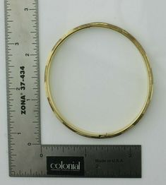 "14K Yellow Gold Hinged Bangle 2 3/8\"x2.25\" oval inside, florentine finished alternating directions, all around, Circa 1950, 8.4 grams Stock # BB207B22 This listing contains photographs of the actual item you will receive. Our items are in excellent condition with little or no signs of wear and many are one of a kind pre-owned estate finds. Please look closely at the pictures in this listing as they are part of the product description. Please read the description, as any imperfections or condi Formal 14k Gold Bracelet, Formal Round Gold Engraved Bracelet, Oval Gold Bracelet Stamped 14k, Heirloom Yellow Gold Oval Bracelet, Antique Oval Bangle For Formal Occasions, Vintage Yellow Gold Hinged Bracelet, Vintage Gold Bracelet With Polished Finish For Formal Occasions, Antique Gold Hinged Bracelet For Formal Occasions, Antique Hinged Gold Bracelet For Formal Occasions