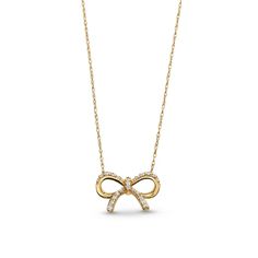 Wrap up your look with sparkle and sweet style when you wear this diamond bow necklace. 10K gold Diamonds shimmer along the ribbon details of this elegantly sculpted bow 1/10 ct. t.w. of diamonds 16.0 to 18.0-inch adjustable cable chain necklace; lobster claw clasp Infinity Necklace With Diamond Accents For Formal Occasions, Formal Infinity Necklace With Diamond Accents, Elegant Infinity Necklace With Brilliant Cut, Elegant 14k Gold Infinity Necklace, Elegant Gold Necklace With Ribbon, Party Jewelry With Diamond Bow, Party Diamond Bow Jewelry, Elegant Yellow Gold Jewelry With Ribbon, Elegant Gold Necklace With Bow Detail