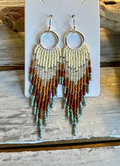 Striking hand-beaded earrings in the long fringe style.  Two pair are inspired by beautiful cities in the Southwest. Two pair are just simple fringe styles. Nickel and lead safe. Bohemian Long Drop Fringe Earrings, Bohemian Long Drop Chandelier Earrings With Tassels, Bohemian Chandelier Earrings With Tassels, Beaded Fringe Dangle Tassel Earrings For Festival, Bohemian Beaded Long Drop Tassel Earrings, Bohemian Chandelier Earrings With Fringe And Round Beads, Bohemian Chandelier Earrings With Fringe, Bohemian Long Drop Tassel Earrings With Colorful Beads, Artisan Fringe Tassel Dangle Earrings