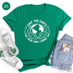 Eco-friendly Green Cotton T-shirt, Earth Day Graphic Tee With Letter Print, Green Short Sleeve Eco-friendly T-shirt, Green Crew Neck Tops For Earth Day, Green Short Sleeved Eco-friendly T-shirt, Eco-friendly Green Cotton Top, Eco-friendly Cotton Graphic T-shirt, Eco-friendly Short Sleeve T-shirt, Eco-friendly Green Crew Neck T-shirt