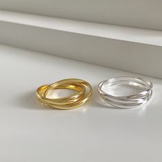 Unveil the beauty of interconnectedness with our Minimalist Sterling Silver Rolling Fidget Ring, a piece that marries minimalist design with the allure of modern sophistication. These statement rings are meticulously crafted from 925 sterling silver, available in two stunning finishes - a radiant 18k gold plating and a sleek silver. The design features three interlocking bands that roll freely over each other, creating a dynamic silhouette that encircles your finger. It's not only a simple ring; Gold Minimalist Sterling Silver Couple Rings, Gold Stackable Rings, Interlocking Ring, Gold Rings Stackable, Fidget Rings, Simple Ring, Ring Minimalist, Minimalist Rings, Rings Simple