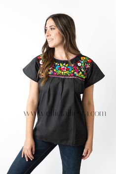 Mexican Embroidered Pueblo Blouse - Black  These fabulous blouses feature a unique colorful embroidered pattern. These embroidered blouses are also commonly known as Mexican Peasant Blouse Tops.  Please note that each blouse is individually hand embroidered so the embroidery design will vary from the one pictured. You will receive the blouse color selected. Black Peasant Blouse With Floral Embroidery, Black Folk Style Peasant Top, Black Embroidered Peasant Top, Black Embroidered Folk Peasant Top, Black Embroidered Cotton Peasant Top, Black Cotton Blouse With Geometric Embroidery, Black Peasant Top With Floral Embroidery For Festivals, Black Floral Embroidered Peasant Top For Festival, Peasant Style Embroidered Black Blouse