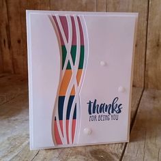 a thank card with an abstract design on the front and bottom, in white paper