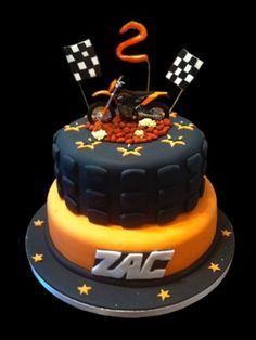 a motorcycle themed birthday cake with the number s on it's top and stars