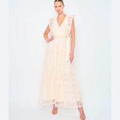 This Cream Dress Has Pink Floral Lace With Subtle Sequins! It Has A Faux Wrap Top With A Tie At The Waist, And Lace Flutter Sleeves. It Has An A-Line Skirt And A Hidden Side Zipper. 100% Polyester. Lining Is 92% Polyester, 8% Spandex. Dry Clean Only. Pink Lace V-neck Maxi Dress, Pink Lace Maxi Dress With V-neck, Spring Pink Lace Maxi Dress, Pink Lace Maxi Dress For Spring, Feminine Beige Maxi Dress, Pink Lace Maxi Dress For Brunch, Feminine Sleeveless Cream Maxi Dress, Faux Wrap Top, Denim Maxi Dress