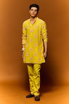 Yellow kurta with floral thread hand embroidery. Paired with a matching plain pant. - Aza Fashions Designer Spring Kurta With Straight Pants, Designer Wear Spring Kurta With Straight Pants, Spring Cotton Traditional Wear With Gota Work, Designer Yellow Lawn Suit With Floral Embroidery, Yellow Cotton Lawn Suit With Floral Embroidery, Spring Traditional Cotton Wear With Gota Work, Traditional Cotton Pant Set For Wedding, Straight Kurta Pant Set With Zari Work For Spring, Traditional Chanderi Pant Set With Long Sleeves