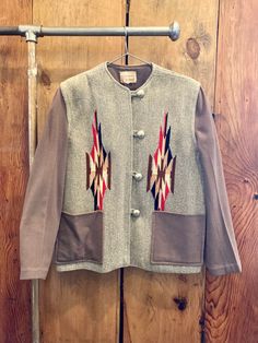 "This jacket belonged to my grandmother who was born in Arizona around 1930 and lived there always. It was a well-kept piece of clothing. It is a Chimayo blanket jacket by Ganscraft from the 1950s. It is all wool with the exception of the inside seams and the pockets which are lined with satin/silk material (see pics). This is a \"size 18\" but that meant something different in the 1950's than it does today so refer to the measurements listed below for a more accurate size description.  Conditio Vintage Hand-stitched Outerwear For Fall, Traditional Outerwear With Button Closure For Fall, 1950s Style Outerwear With Button Closure For Fall, 1950s Style Fall Outerwear With Button Closure, Tailored Vintage Cotton Outerwear, 1950s Vintage Style Outerwear With Buttons, Vintage Hand-stitched Long Sleeve Outerwear, Vintage Chainstitch Jacket, Chimayo Jacket