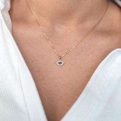 This evil eye necklace is the perfect gift for your loved one, or yourself! The center enamel evil eye is surrounded by sparkling diamonds to complete the marquise shape.