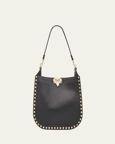 Valentino Garavani hobo bag in calfskin leather with Rockstud trim     Detachable shoulder strap     Detachable, adjustable crossbody strap    Can be worn as a shoulder or crossbody bag     Open top with liftclasp closure     Approx. 10.2"H x 7.9"W x 3.9"D    Made in Italy Luxury Hobo Shoulder Bag With Gunmetal Hardware, Luxury Hobo Shoulder Bag With Metal Hardware, Luxury Crossbody Hobo Bag With Silver-tone Hardware, Luxury Silver-tone Crossbody Hobo Bag, Luxury Crossbody Hobo Bag With Gunmetal Hardware, Luxury Hobo Bag With Gunmetal Hardware Crossbody, Designer Crossbody Hobo Bag With Gold-tone Hardware, Luxury Hobo Bag With Gunmetal Hardware In Tote Shape, Luxury Hobo Bag With Gunmetal Hardware