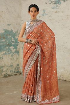 Rust handcrafted handwoven tusser silk saree with statement border in metallic silver floral, applique, aari and zardozi hand embroidery. Comes with matching plain unstitched blouse piece. - Aza Fashions Copper Saree, Floral Applique, Blouse Piece, Aza Fashion, Silk Saree, Western Fashion, Silk Sarees, Hand Embroidered, Hand Embroidery