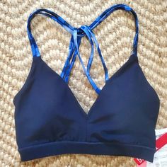 This Navy Blue Sports Bra Is Brand New With Tags Still Attached. The Pads Are Removable. I'd Say It Fits True To Size. Sporty Fitted V-neck Swimwear, Seamless Triangle Top Activewear For Workout, V-neck Stretch Swimwear For Workout, Triangle Top Athleisure Workout Tops, Sporty Stretch Triangle Top, Triangle Top Activewear For Workout, Athleisure Triangle Top Activewear For Gym, Triangle Top Workout Tops In Athleisure Style, Sporty Seamless Triangle Top Activewear