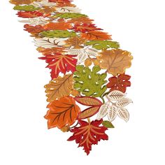 a long line of autumn leaves on a white background