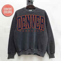 Comfort Colors Denver Football Sweatshirt, Denver Football Sweater, Vintage Style Denver Football Shirt, Denver Football fan Gift -Please check Color and Size Charts before placing the order. You can find them in the listing's photos (Depending on what device you are viewing this listing colors may vary slightly). -Returns and exchanges are accepted only if there are defects "No Extra Costs" We create custom t-shirts with great designs for everyone's liking. If you don't find the size or color y Throwback Long Sleeve Tops With Team Logo, Throwback Long Sleeve Tops For Game Day, Throwback Relaxed Fit Tops For Game Day, Relaxed Fit Throwback Tops For Game Day, Throwback Sports Season Tops With Relaxed Fit, Throwback Long Sleeve Tops With Letter Print, Winter College Tops With Team Logo, Winter College Top With Team Logo, Throwback Fan Gear Tops For Fall