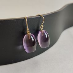 ITEM DESCRIPTION: >> The earrings are made from Solid 14K Yellow Gold. Gemstone used is absolutely natural and ethically sourced. >> Natural Amethyst in tube shape and drill setting is studded on it with utmost precision.  >> This is a minimalist design and is absolutely hassle-free and everyday jewelry.  Gem: Purple Amethyst Gem size & shape: 10 x15 mm and tube Gem weight: 24.75 cts Gold purity: 14K (58.33% approx.) Gold weight: 0.56 grams  Gross weight: 5.51 grams The Gold purity is guaranteed and it comes with authentic 14K gold hallmark. Since these Earrings are handmade, they are Nickel/Lead FREE.  CUSTOMIZATION: --> You can choose your own gemstone. --> Kindly drop a message for more options. CUSTOMER SUPPORT: --> We are available 24/7 to respond to all your queries!  PACKAGING: --> Luxury Amethyst Teardrop Earrings, Luxury Amethyst Earrings For Gift, Oval Amethyst Earrings With Gemstone Accents, Purple Briolette Fine Jewelry Earrings, Amethyst Briolette Earrings For Formal Occasions, Elegant Polished Amethyst Gemstones, Amethyst Earrings Fine Jewelry For Formal Occasions, Formal Amethyst Briolette Earrings, Yellow Gold Amethyst Earrings Hallmarked