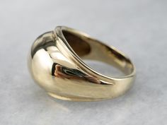 This vintage gold band is simple, yet beautiful on the hand! Sleek and minimalist, this ring has a high-profile dome that tapers gracefully down the shoulders. This band would pair easily with a variety of jewelry! Metal: 14K Yellow Gold Width of Band: 11.9 mm Height off Finger: 4 mm Ring Size: 3.25 Marks: "14K" Stamped on the inside band Vintage Gold Band, Right Hand Ring, Gold Statement Ring, Jewelry Metal, Right Hand Rings, Hand Ring, Gold Band Ring, Pinky Ring, Minimalist Rings