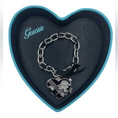 Guess Heart Bracelet Winter 2011 Silver Heart Charm Bracelet For Party, Black Bracelets For Party On Valentine's Day, Valentine's Day Black Heart Charm Bracelet, Black Heart Bracelet For Gift, Black Metal Heart Bracelet As Gift, Black Heart Bracelets With Heart Charm, Silver Heart Bracelet For Valentine's Day Party, Black Heart Charm Bracelet, Elegant Black Heart Bracelet As Gift