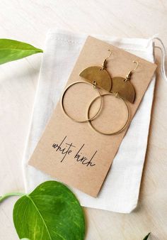 Featured by ETSY! Our classic geometric brass earrings! •••••••••••••••••••••••••••••••••••••••��••••••••••••••••••••••• • ORDERING • These leather earrings measure approx 1 1/4" wide, 2 1/2" drop with hook. Each pair of earrings come on an earring card with clear silicone backers. All orders come beautifully packaged in re-usable 100% cotton bags, perfect for gifting! •••••••••••••••••••••••••••••••••••••••••••••••••••••••••••••• • INFO • These earrings come with raw brass or 14K gold fill hooks, Brass Earrings Handmade, Moon Circle, Diy Jewelry To Sell, Brass Circle, Half Moon Earrings, Brass Collection, Crescent Earrings, Earring Card, Earring Cards