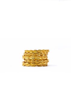 stack of gold rings against a white background