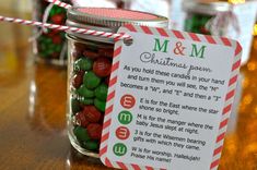 a jar filled with m & m candies on top of a table