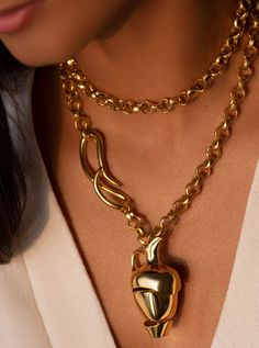 Throughout time humans have looked to the stars for inspiration. Handcrafted in bronze, plated in 22k Gold, the Amphora Necklace is inspired by the undulating form of a water vessel, an elevated representation of how distant constellations and the cosmos can find form in sculpture.